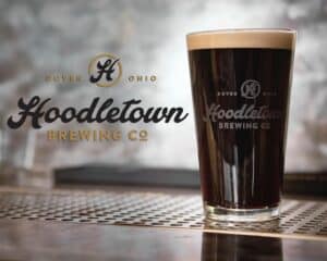 Pint glass filled with Hoodletown Brewery's Munich Dunkel beer.